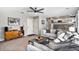 Cozy living room with a ceiling fan and an open view to the kitchen at 2488 W 111Th Pl, Denver, CO 80234