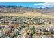 Scenic aerial view showcases neighborhood homes against a backdrop of mountains at 7835 Canvasback Cir, Littleton, CO 80125