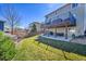 Backyard featuring a deck, patio and lawn, perfect for outdoor living and entertaining in a serene setting at 7835 Canvasback Cir, Littleton, CO 80125