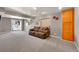 Finished basement with plush carpet, sliding glass door to the backyard, and bonus storage cabinets at 7835 Canvasback Cir, Littleton, CO 80125