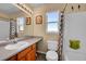 Bright bathroom featuring a shower with a whimsical shower curtain and frog at 7835 Canvasback Cir, Littleton, CO 80125