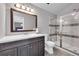 Bathroom features a large vanity and glass enclosed shower with mosaic tile accents at 7835 Canvasback Cir, Littleton, CO 80125