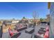 Entertain on this spacious deck with wrought iron railing, comfortable seating and dining table, perfect for Gathering gatherings at 7835 Canvasback Cir, Littleton, CO 80125
