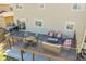 This home features a spacious deck with outdoor dining table and comfortable seating, with a grill ready for BBQ at 7835 Canvasback Cir, Littleton, CO 80125