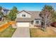 Charming two-story home with a well-manicured front lawn and a two-car garage, offering comfort and curb appeal at 7835 Canvasback Cir, Littleton, CO 80125