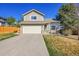 Charming two-story home featuring a two-car garage and well-maintained front yard at 7835 Canvasback Cir, Littleton, CO 80125