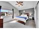 Spacious primary bedroom with vaulted ceiling, ceiling fan, and large windows offering lots of light at 7835 Canvasback Cir, Littleton, CO 80125
