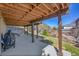 Covered outdoor patio with ample space, offering a perfect spot for relaxing or entertaining in any weather at 7835 Canvasback Cir, Littleton, CO 80125