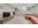 Spacious basement with tile floor and comfortable seating area at 3614 W Radcliff Ave, Denver, CO 80236