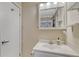 Clean and simple bathroom with vanity and mirror at 3614 W Radcliff Ave, Denver, CO 80236