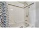 Bathtub with shower featuring classic white tile at 3614 W Radcliff Ave, Denver, CO 80236