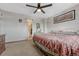 Bedroom with neutral decor and access to attached bathroom at 3614 W Radcliff Ave, Denver, CO 80236