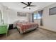 Comfortable bedroom with ceiling fan and natural light at 3614 W Radcliff Ave, Denver, CO 80236