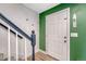 Stairway near the front door with modern railing and wood floors at 3614 W Radcliff Ave, Denver, CO 80236