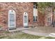 Close-up of brick townhouse entrances and landscaping at 3614 W Radcliff Ave, Denver, CO 80236