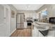 Updated kitchen with stainless steel appliances and granite countertops at 3614 W Radcliff Ave, Denver, CO 80236
