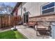 Back patio with comfortable seating and privacy fencing at 3614 W Radcliff Ave, Denver, CO 80236