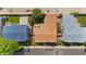 Aerial view of a single-Gathering home with mature trees and a well-manicured lawn surrounded by other houses at 113 Rockaway Ave, Castle Rock, CO 80104