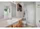 Full bathroom featuring a sink, toilet, and shower, with a decorative shower curtain at 113 Rockaway Ave, Castle Rock, CO 80104