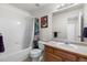 Full bathroom with shower over tub, modern fixtures, and vanity with storage space at 113 Rockaway Ave, Castle Rock, CO 80104