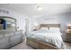 Bright bedroom featuring coordinated furniture, a comfortable bed, and ample natural light at 113 Rockaway Ave, Castle Rock, CO 80104