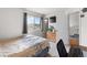 Bright bedroom with large window, dresser, and mounted TV, offering a comfortable living space at 113 Rockaway Ave, Castle Rock, CO 80104