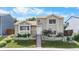 Charming two-story home with a well-maintained lawn and landscaped garden, enhanced by a neatly stepped walkway at 113 Rockaway Ave, Castle Rock, CO 80104