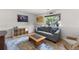 Finished basement living room features stylish decor, comfortable seating, and ample natural light at 113 Rockaway Ave, Castle Rock, CO 80104