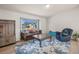 Comfortable living room featuring a sofa, armchair, and natural light, perfect for relaxing or entertaining at 113 Rockaway Ave, Castle Rock, CO 80104