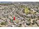 Aerial view of a residential neighborhood featuring beautiful homes, green spaces, and winding streets at 24487 E Frost Dr, Aurora, CO 80016