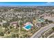 Expansive aerial view of community amenities including a pool, tennis courts, parks and lush green spaces at 24487 E Frost Dr, Aurora, CO 80016
