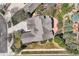 Aerial view of a home showcasing the roof, driveway, patio, landscaping, and surrounding neighborhood at 24487 E Frost Dr, Aurora, CO 80016