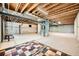 Partially finished basement with exposed beams and ductwork and new carpeting at 24487 E Frost Dr, Aurora, CO 80016