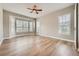 Bright, spacious bedroom with natural light, hardwood floors, and large bay windows with shutters at 24487 E Frost Dr, Aurora, CO 80016