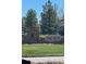 Community Entrance: Tallac's Reach entrance sign surrounded by mature trees and green lawn at 24487 E Frost Dr, Aurora, CO 80016