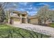 Lovely exterior view of a two-story home with a three-car garage, stone accents, and lush green lawn at 24487 E Frost Dr, Aurora, CO 80016