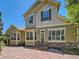 Stunning two-story home with stone accents, large windows, and flagstone patio, perfect for outdoor enjoyment at 24487 E Frost Dr, Aurora, CO 80016