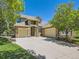 Inviting exterior of a two-story home featuring a three-car garage and stone accents at 24487 E Frost Dr, Aurora, CO 80016