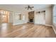 Inviting living room showcasing a stone fireplace, hardwood floors, and open layout at 24487 E Frost Dr, Aurora, CO 80016