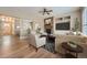 Spacious living room features a stone fireplace, hardwood floors, and natural light at 24487 E Frost Dr, Aurora, CO 80016