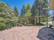 Inviting outdoor patio area with flagstone paving, pergola, seating, and lush greenery, great for entertaining at 24487 E Frost Dr, Aurora, CO 80016