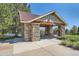 Stone picnic pavilion with a metal roof, offering a shaded area for outdoor gatherings and dining at 24487 E Frost Dr, Aurora, CO 80016