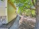 Serene side yard with gravel path, mature trees, and stone accents, creating a tranquil outdoor space at 24487 E Frost Dr, Aurora, CO 80016