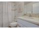 Bathroom with shower/tub combo with tile surround, white vanity, and chrome hardware at 5863 N Boston St, Denver, CO 80238