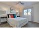 Cozy bedroom with a large window, soft carpet, and a queen-sized bed with accent pillows at 5863 N Boston St, Denver, CO 80238