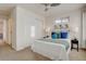 Bright bedroom with large windows, a ceiling fan, and a queen-sized bed with stylish pillows at 5863 N Boston St, Denver, CO 80238