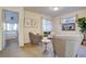 Cozy living room with comfortable seating, soft carpet, and a view into an adjacent bedroom at 5863 N Boston St, Denver, CO 80238