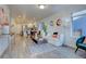 Open-concept living room boasts hardwood floors, abundant natural light, and flows seamlessly into the modern kitchen at 5863 N Boston St, Denver, CO 80238
