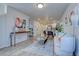 Open-concept living room featuring stylish decor, hardwood floors, and an easy flow into the contemporary kitchen at 5863 N Boston St, Denver, CO 80238