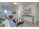 Sun-drenched living area showcasing wood floors, elegant furniture, and a welcoming space perfect for relaxing or entertaining at 5863 N Boston St, Denver, CO 80238